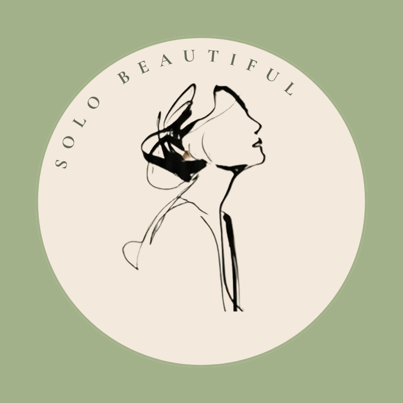 Profile of a woman as a line drawing lookup slightly upward. The words "Solo Beautiful" in an arc above her head. The profile is in a circle with a cream background and there is an overlay of moss green surrounding it in a square shape.